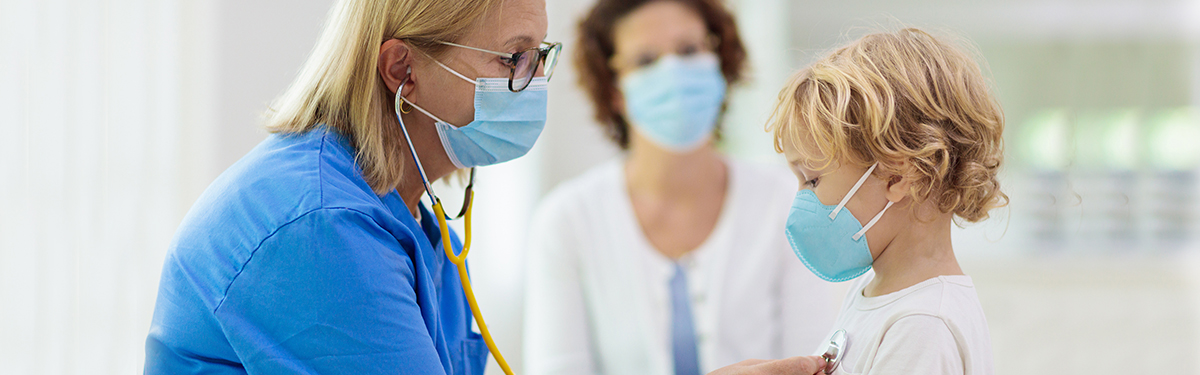doctor examining child