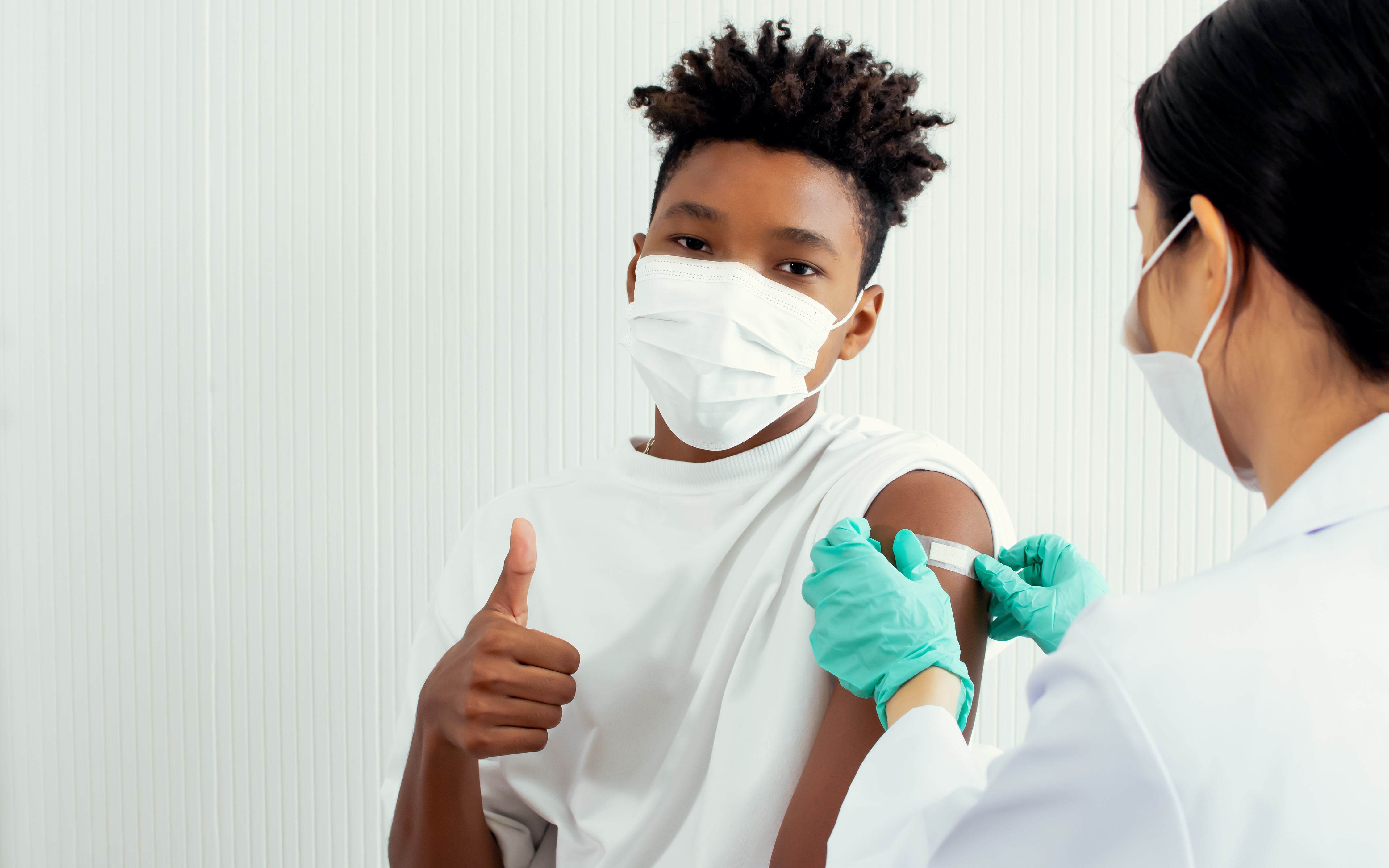 teen vaccine thumbs up