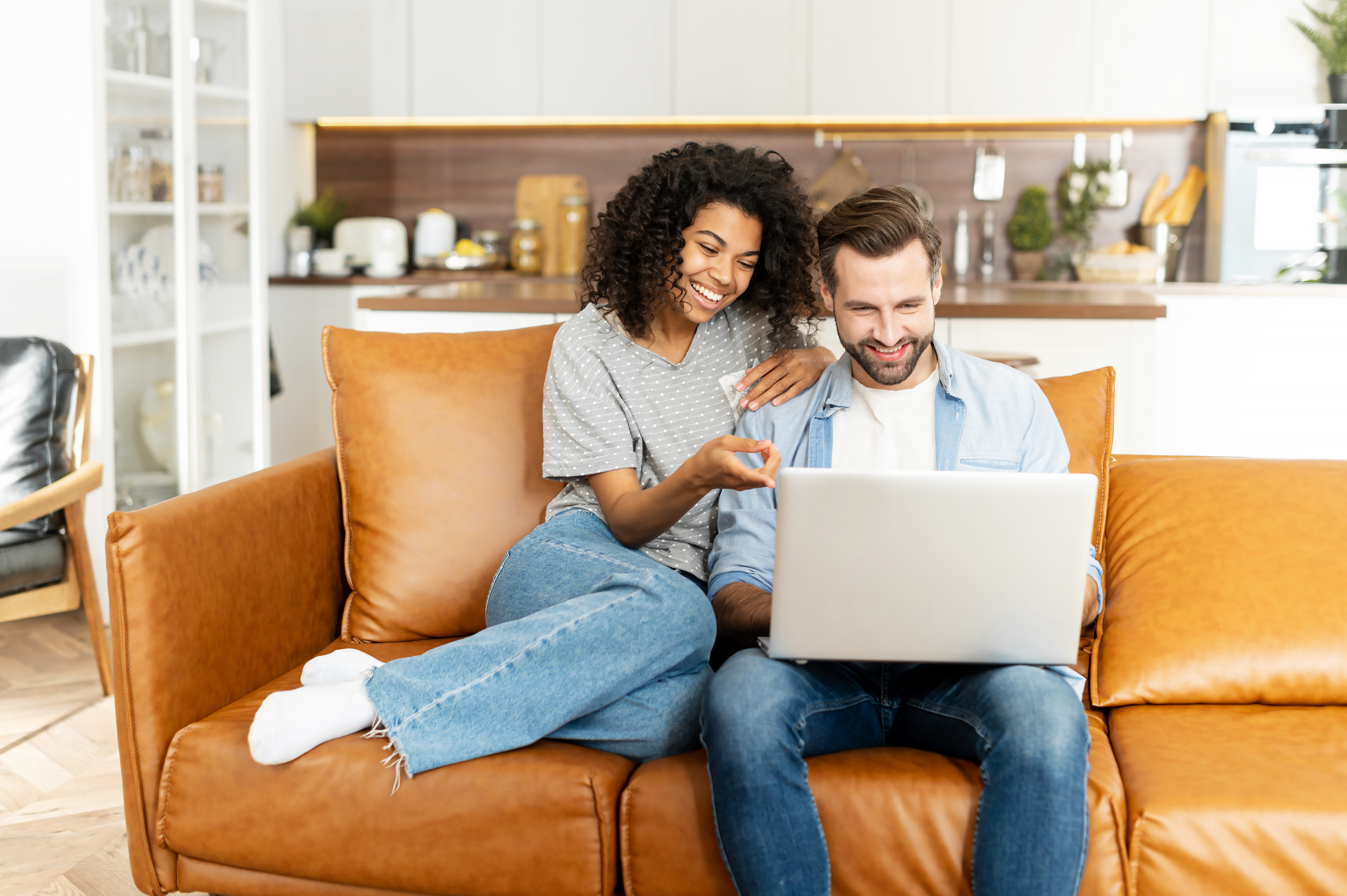 diverse couple on computer attending online baby class expecting parent pregnant