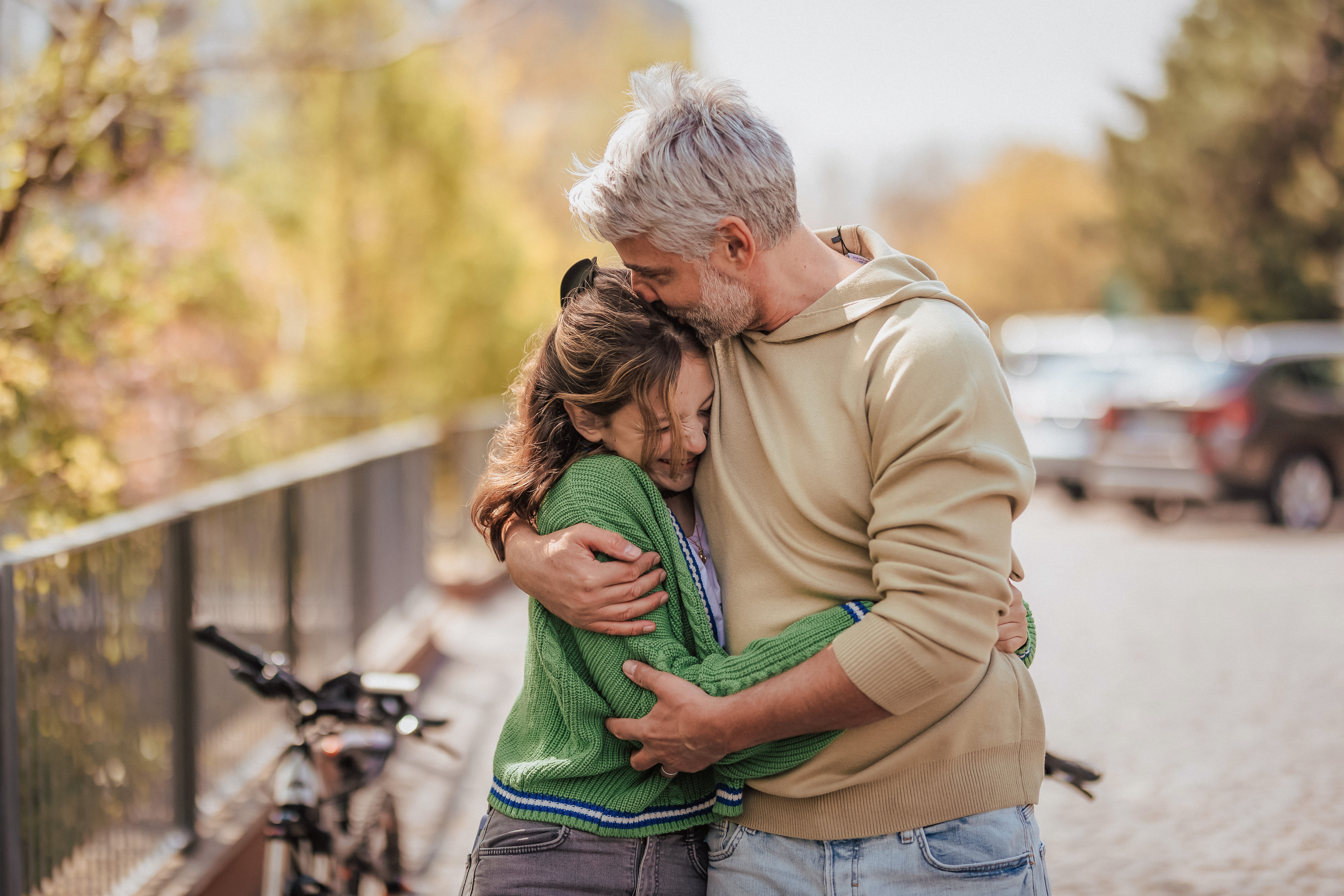 How to Survive Perfectionism parenting class image dad hugging teen daughter